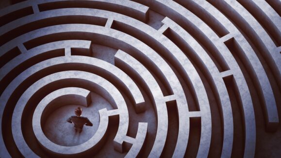 Businessman,At,The,Center,Of,A,Maze