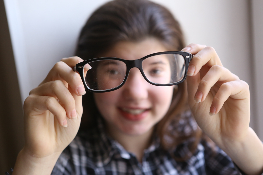 Happy,Teenager,Shortsighted,Girl,With,Myopia,Wearing,New,Sight,Correction