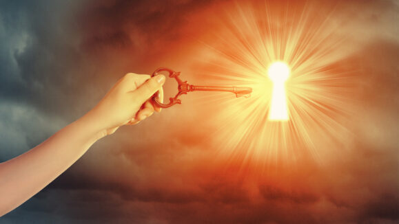 Close,Up,Image,Of,Human,Hand,Inserting,Key,In,Key