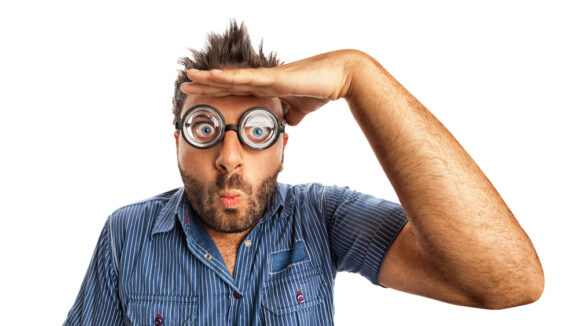 Man,With,Funny,Expression,And,Thick,Glasses,Looking,Far,Away