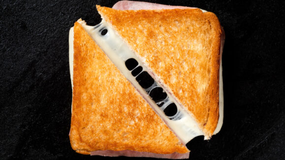 Classic,Cheese,And,Ham,Toasted,Sandwich,Cut,In,Half,Isolated