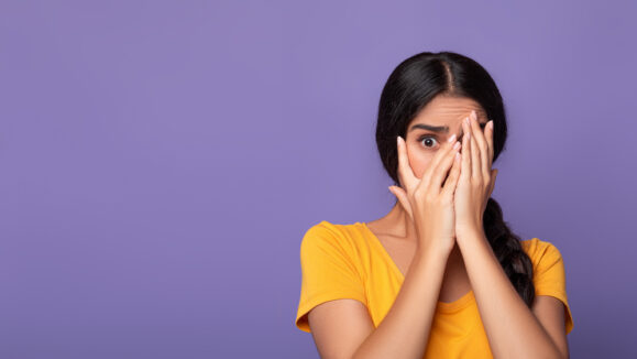 Portrait,Of,Shocked,And,Scared,Young,Indian,Lady,Covering,Her